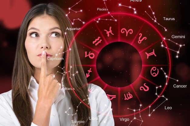 How Your Horoscope Can Help You Prepare for Major Life Events 2 Thoughtful woman looking up with red zodiac wheel and astrology symbols.
